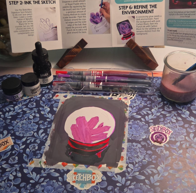 September 2026 SketchBox crystal ball mixed-media painting with pink and purple crystals, a dark background, and red and black base surrounded by the project supplies.